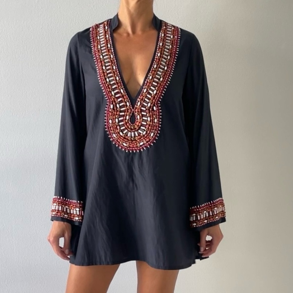 Navy tunic or a mini dress
With beading details